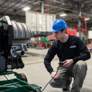 Electrician Bending Conduit Hart Transportation